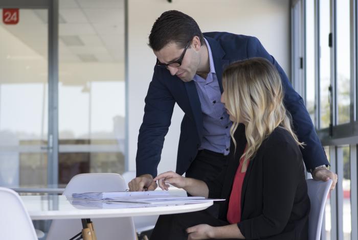 Photo of professionals reviewing documents