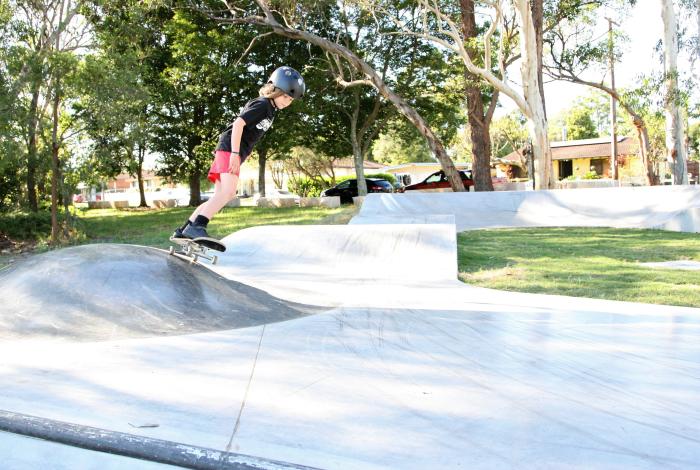 Child skating at skate park