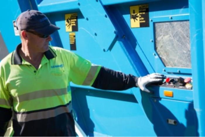 Photo of employee at garbage truck