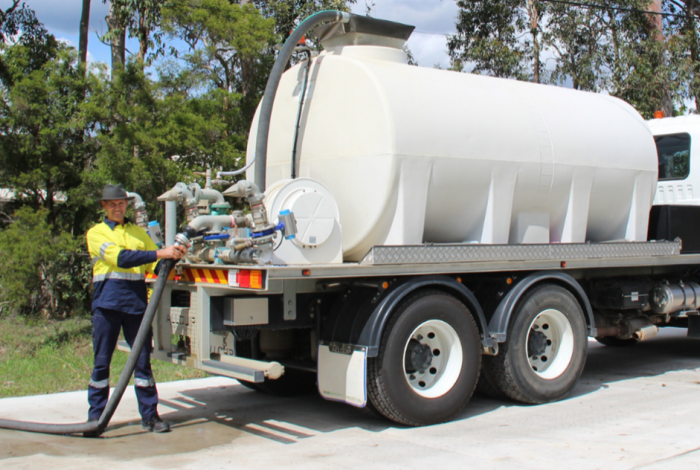 Man with water truck. 