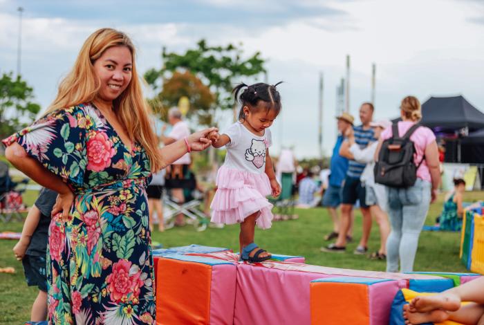 Photo of woman and child playing at CCC Australian Day celebration